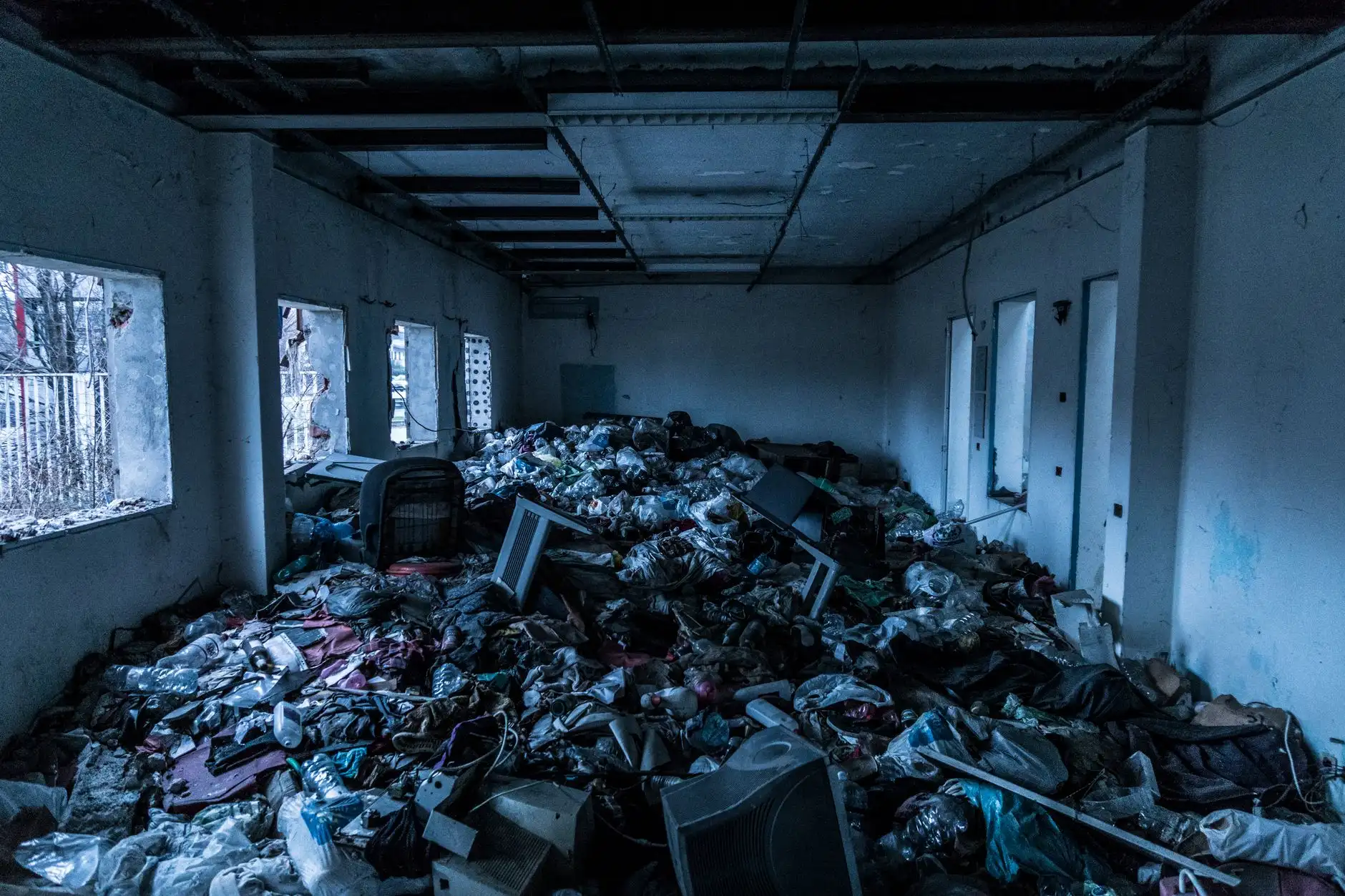 Room piled with junk before a full cleanout
